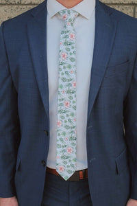 man in blue suit with agave and succulent tie